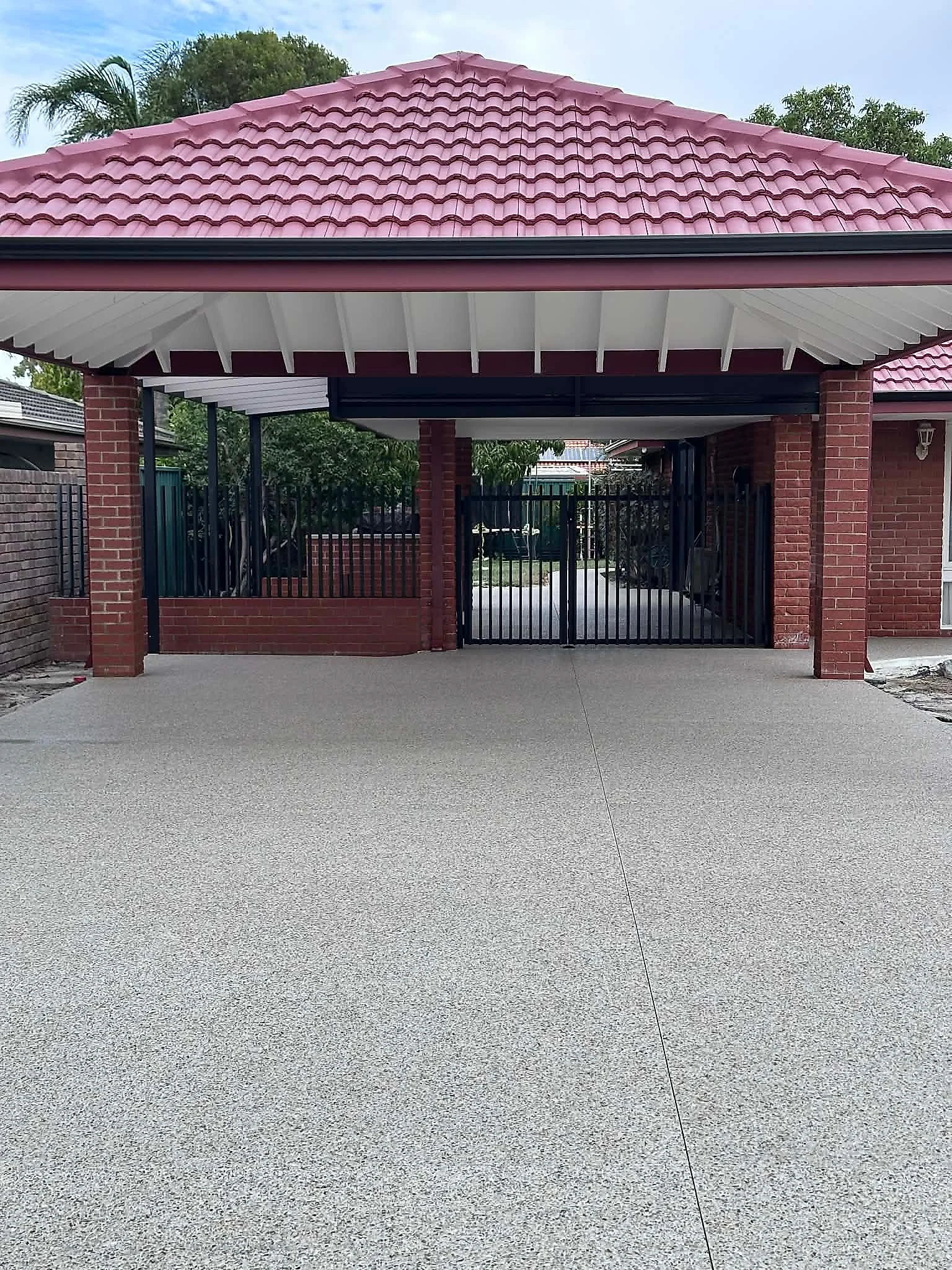 Tired original driveway and carport slab taken out and replaced with eucalyptus white exposed aggregate, carri