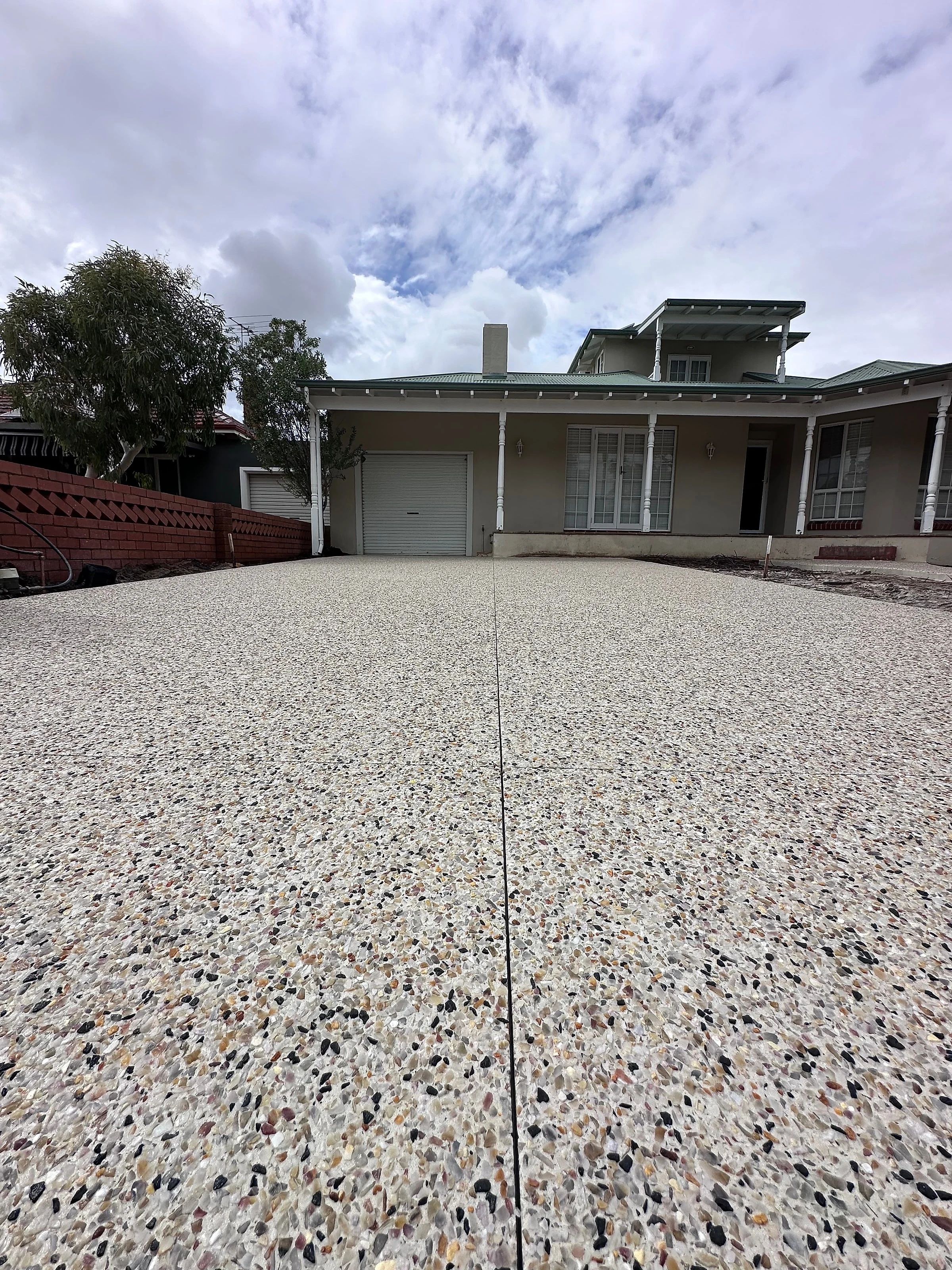 A 100m2 rip out and replace. The old surface came out and the whole frontage went back as one exposed aggregat