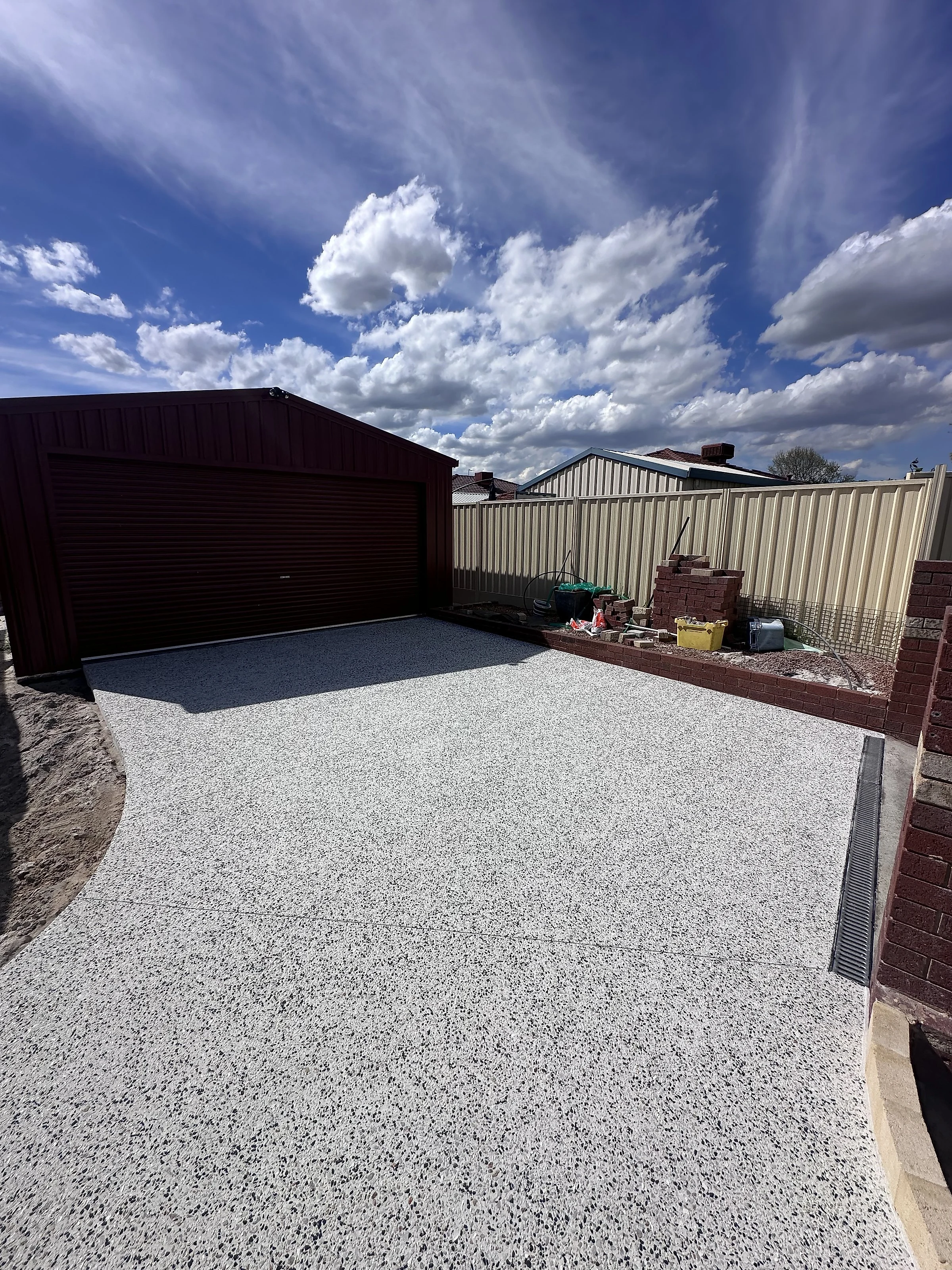 85 square metres of exposed aggregate around an established Wembley Downs home, taking in the driveway up to a