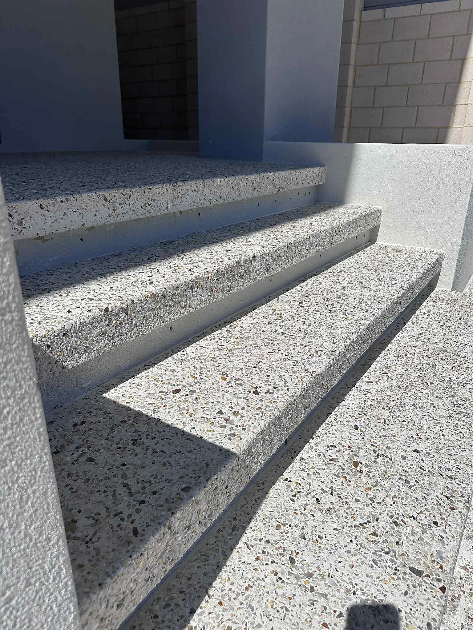 Exposed aggregate steps to a building entrance
