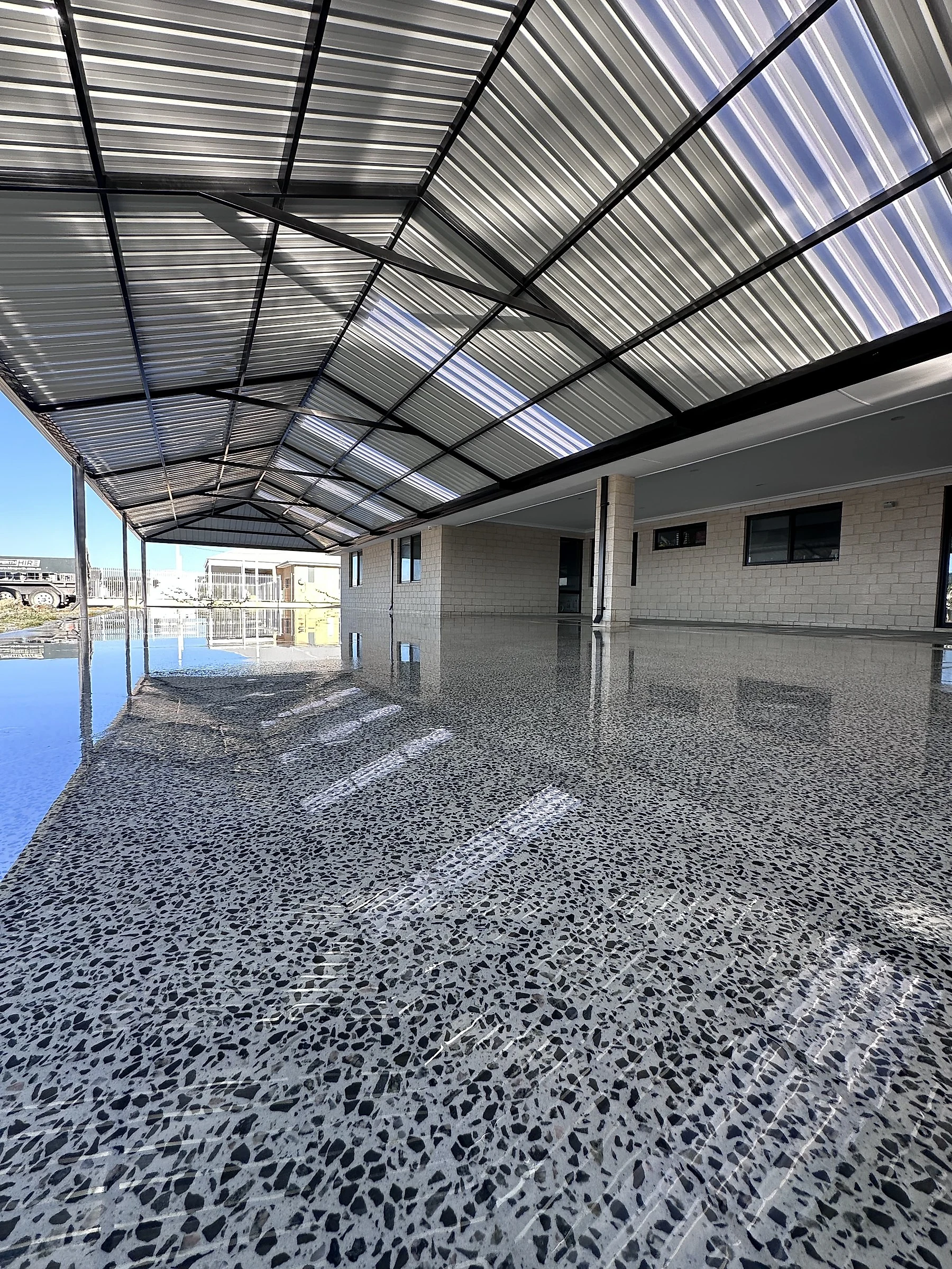 Honed floor, ground back to bring the black and white aggregate up