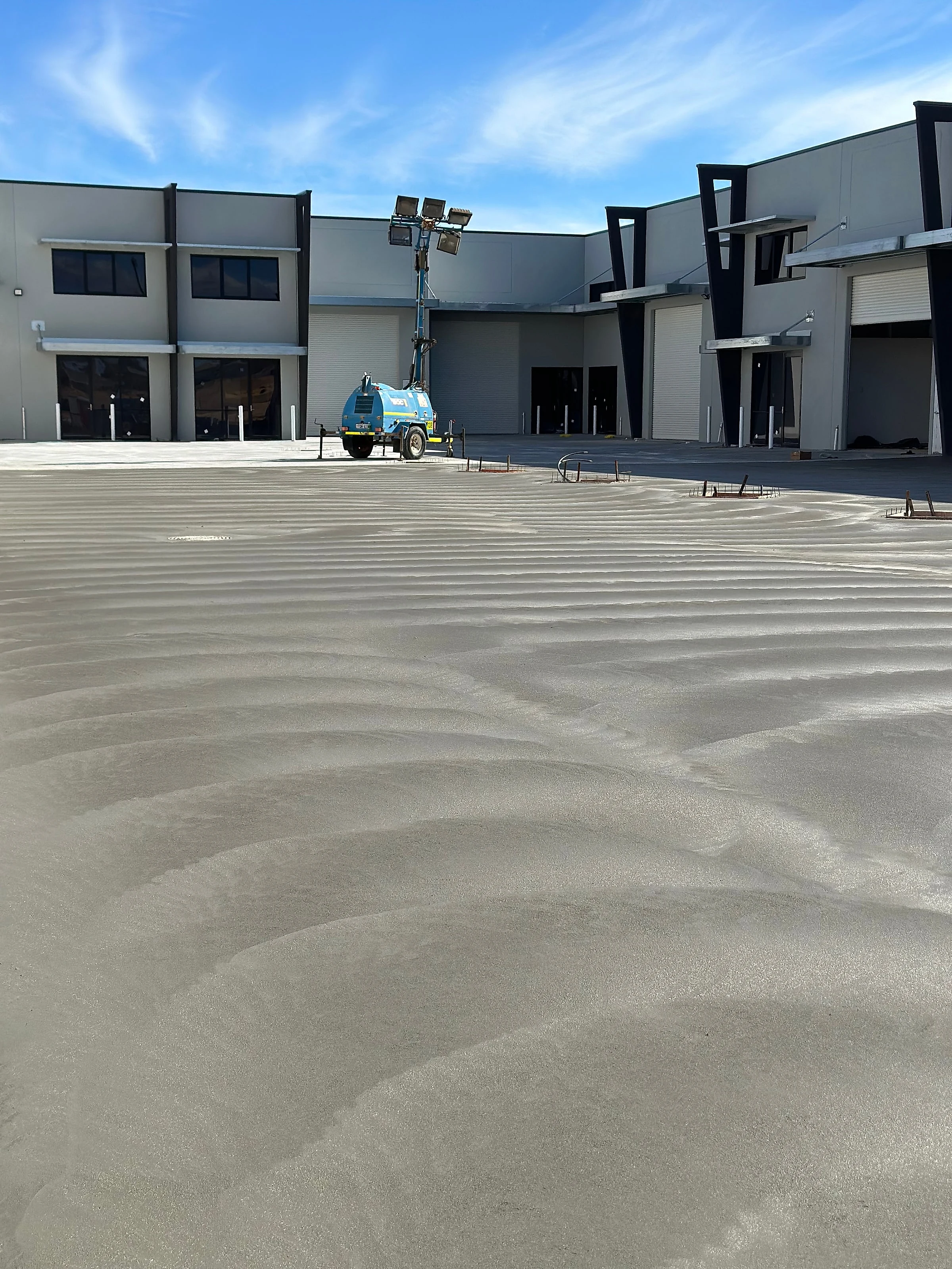 Slab across a row of new commercial units
